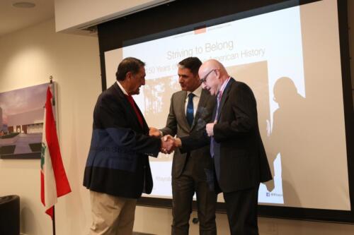 Dr. Paul Wakim and Dr. Mike Ahmar honoring Dr. Moise Khayrallah with medal of honor. 